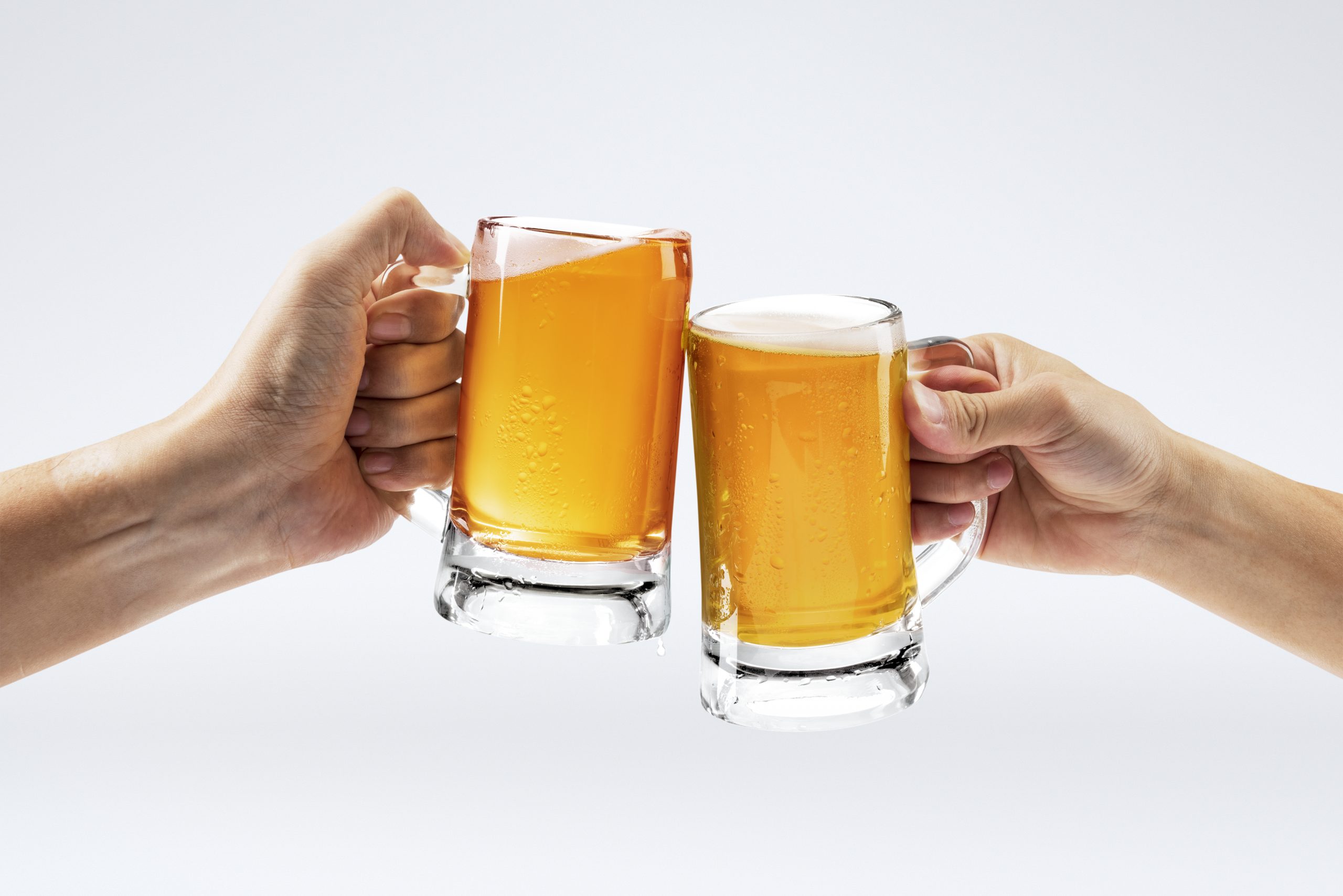 men toasting with beer white background scaled